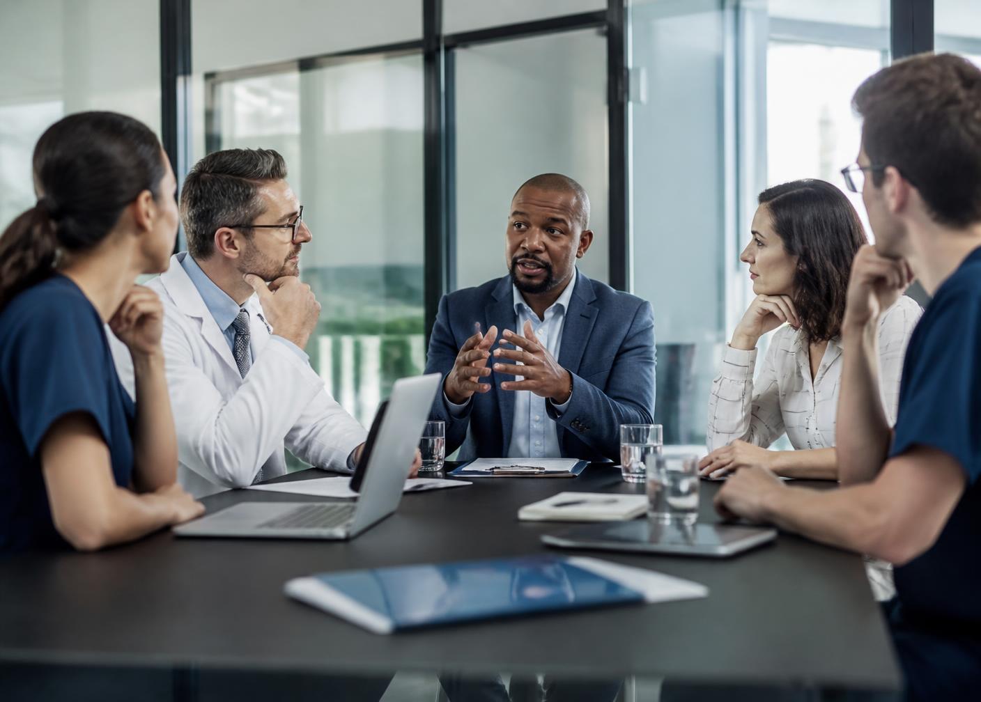 Researchers and clinicians collaborating in a modern laboratory